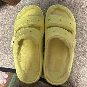 Yellow fuzzy croc slides